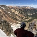 Man looks at mountains in Silverton Colorado