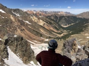 Man looks at mountains in Silverton Colorado